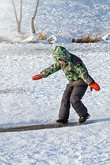 Image showing Boy Sliding on Ice Rink