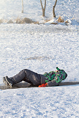 Image showing Boy Sliding on Ice Rink