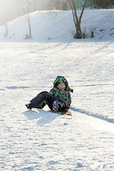 Image showing Boy Sliding on Ice Rink