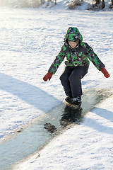 Image showing Boy Sliding on Ice Rink