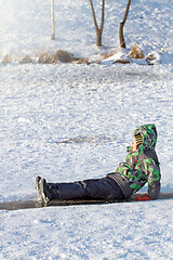 Image showing Boy Sliding on Ice Rink