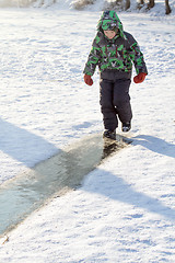 Image showing Boy Sliding on Ice Rink