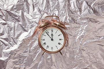 Image showing Retro cooper alarmclock on abstract background.
