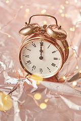 Image showing Golden retro alarmclock with exact New Year time.