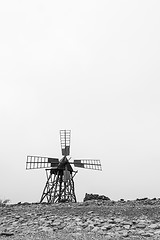 Image showing Old wooden windmill in bw