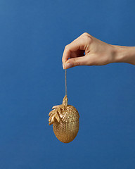 Image showing New Year decoration hanging on a hand.