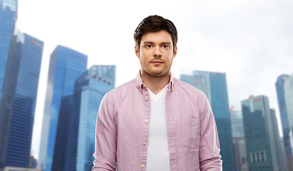 Image showing man over singapore city skyscrapers background