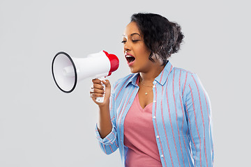 Image showing happy african american woman over grey background