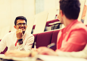 Image showing group of students with notebooks in lecture hall