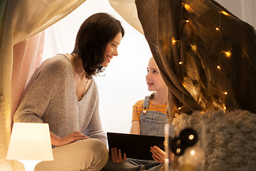 Image showing family with tablet pc in kids tent at home