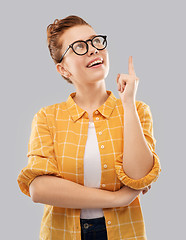 Image showing smiling red haired teenage student girl in glasses