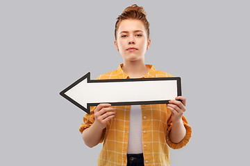 Image showing red haired teenage girl with arrow showing to left