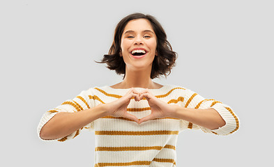 Image showing happy smiling woman in striped pullover