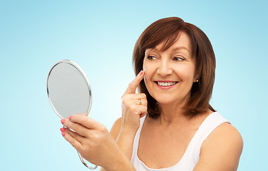 Image showing portrait of smiling senior woman with mirror