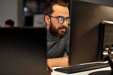 Image showing close up of creative man working at night office