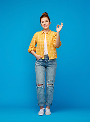 Image showing happy red haired teenage girl showing ok hand sign