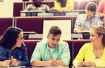 Image showing group of students with notebooks in lecture hall