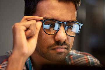 Image showing close up of creative man working at night office