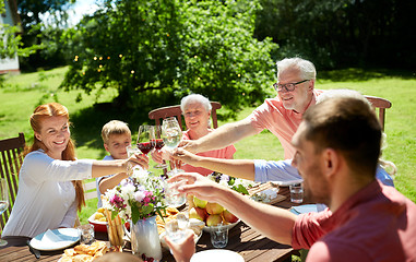 Image showing happy family having dinner or summer garden party