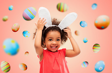 Image showing happy little girl wearing easter bunny ears