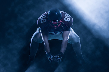 Image showing American football player starting football game