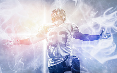 Image showing american football player celebrating after scoring a touchdown