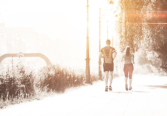 Image showing young couple jogging  in the city