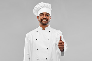 Image showing happy male indian chef in toque showing thumbs up