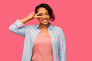 Image showing happy african american woman showing peace