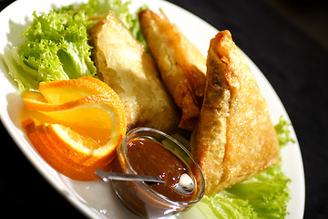 Image showing samosa with plum sauce