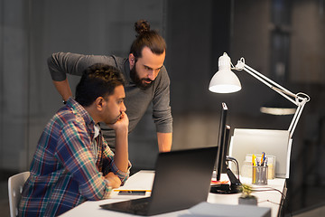 Image showing creative team with computer working late at office