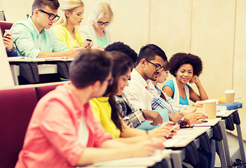 Image showing group of students with coffee writing on lecture