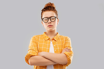 Image showing redhead student girl in glasses with crossed arms