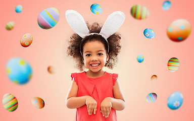 Image showing happy little girl wearing easter bunny ears