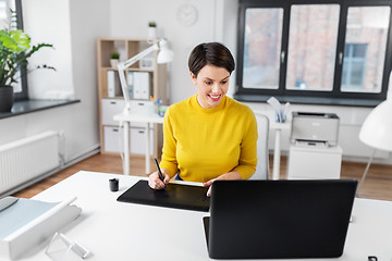 Image showing designer with computer and pen tablet at office