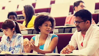 Image showing group of students with notebooks in lecture hall