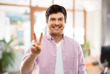 Image showing man showing two fingers or peace over office room