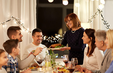 Image showing happy family having dinner party at home