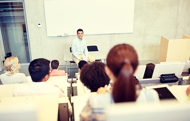 Image showing group of students and teacher at lecture