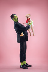 Image showing Halloween Family. Happy Father and Children Girl in Halloween Costume and Makeup