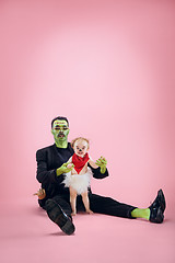 Image showing Halloween Family. Happy Father and Children Girl in Halloween Costume and Makeup