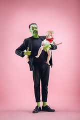 Image showing Halloween Family. Happy Father and Children Girl in Halloween Costume and Makeup