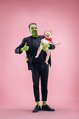 Image showing Halloween Family. Happy Father and Children Girl in Halloween Costume and Makeup