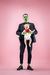 Image showing Halloween Family. Happy Father and Children Girl in Halloween Costume and Makeup