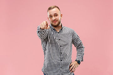 Image showing The happy business man point you and want you, half length closeup portrait on pink background.