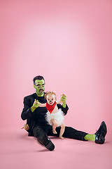 Image showing Halloween Family. Happy Father and Children Girl in Halloween Costume and Makeup