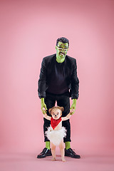 Image showing Halloween Family. Happy Father and Children Girl in Halloween Costume and Makeup