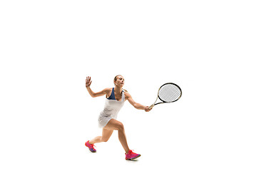 Image showing Adult woman playing tennis. Studio shot over white.