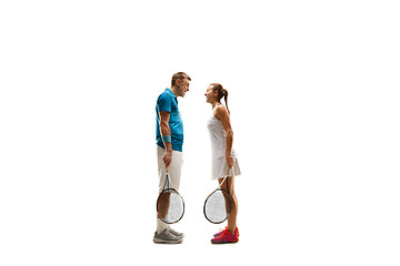 Image showing caucasian man and woman as tennis players posing isolated on white background