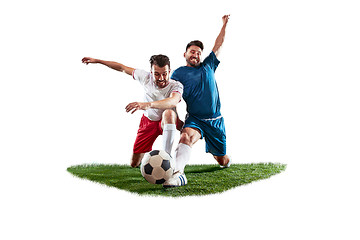 Image showing Football players tackling for the ball over white background